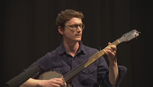 A man playing a banjo