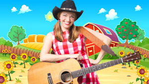 A woman wearing a cowboy hat with a guitar