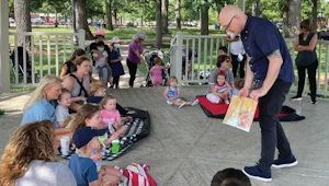 People at an outdoor storytime
