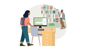 An image of a person at the library on the computer