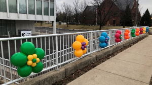 Balloons deocroate the library's fince