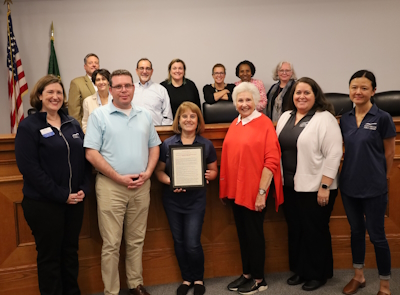 A photo of Library and Village Board Members