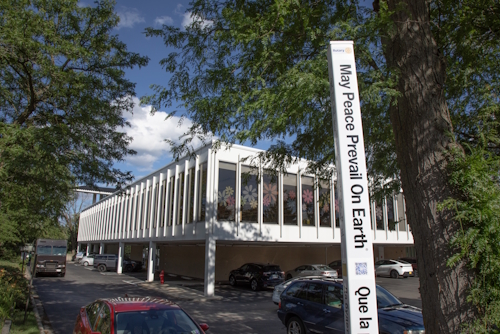 A large pole stands near the library's sign