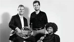 Musicians holding their instruments