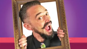 A photo of a man popping out of a picture frame