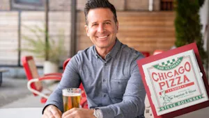 A photo of Steve Dolinsky and his Chicago Pizza book
