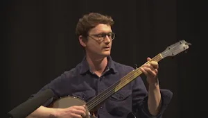A man playing a banjo