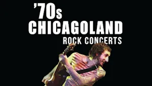 A rock musician playing a guitar