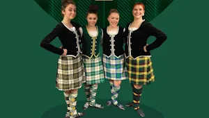 four girls wearing Highland Dancer outfits