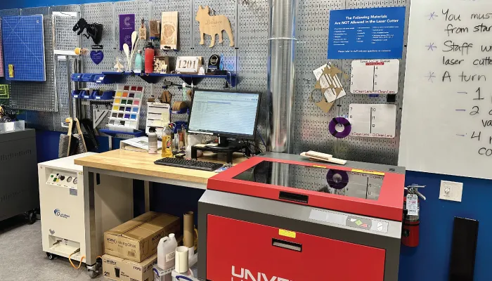 A photo of the laser cutter in the collaboratory